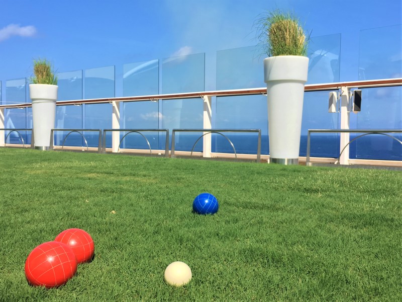 The Grassy Lawn on Celebrity Equinox, Deck 15 with bocce balls in the foreground