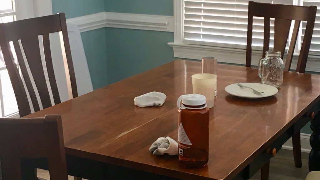 Kitchen table cluttered with dirty dishes