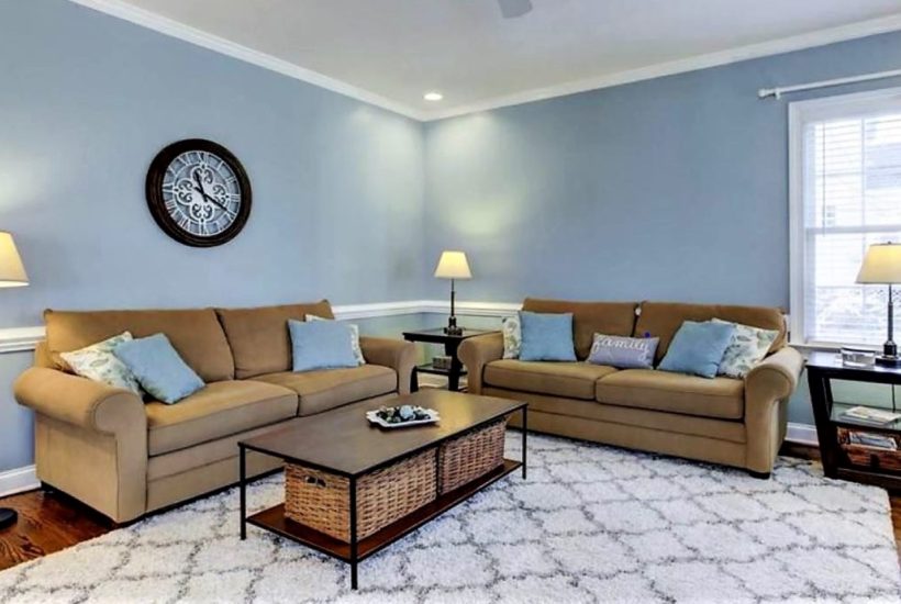 clean living room with couches, neat pillows and clear coffee table