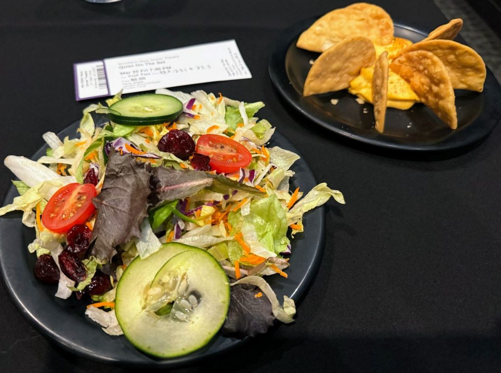 Salad and cheese dip appetizer at Wohlfahrt Dinner Theater.